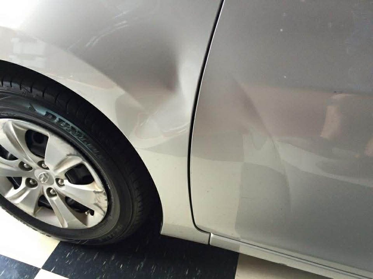 Panel crease before PDR repair Hobart Tasmania