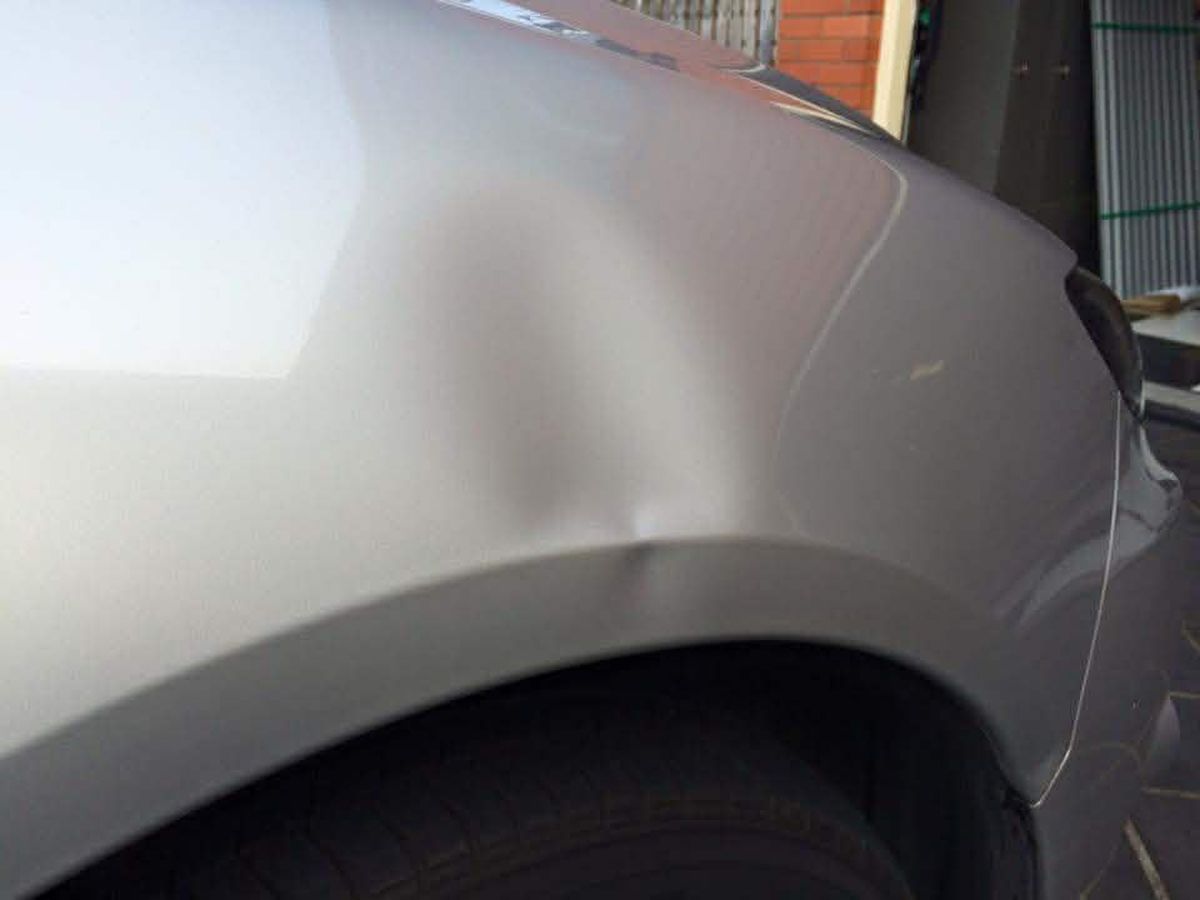 Panel crease before PDR repair Hobart Tasmania