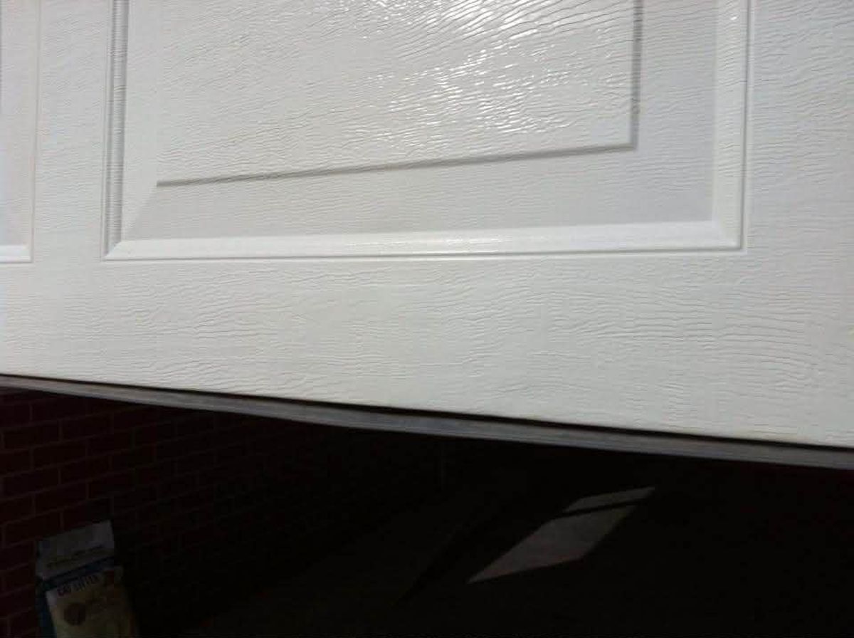 Garage roller door dent after repair Hobart