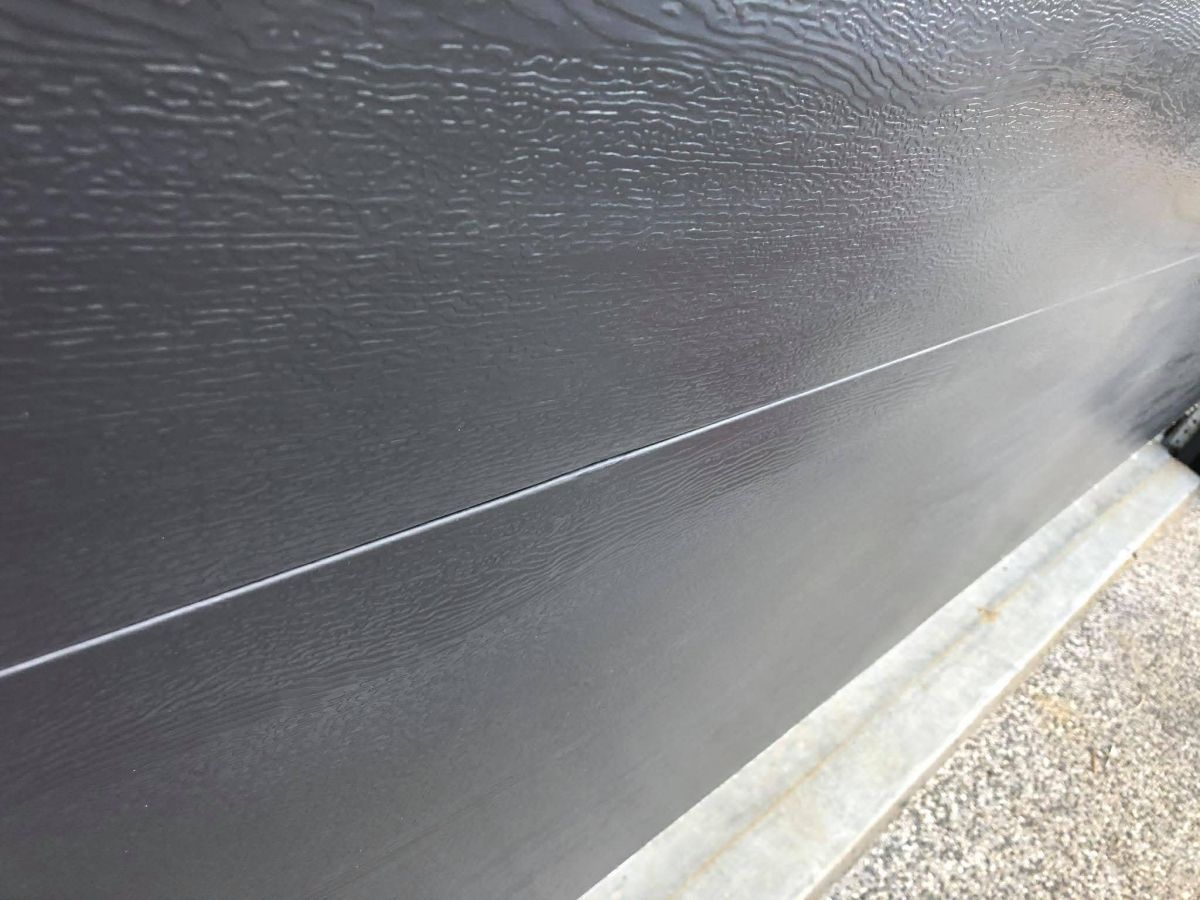 Garage roller door dent after repair Hobart