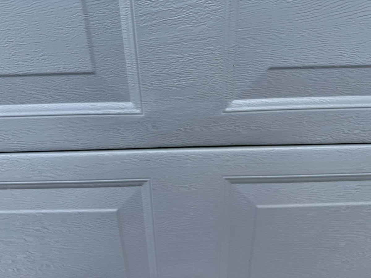 Garage roller door dent after repair Hobart